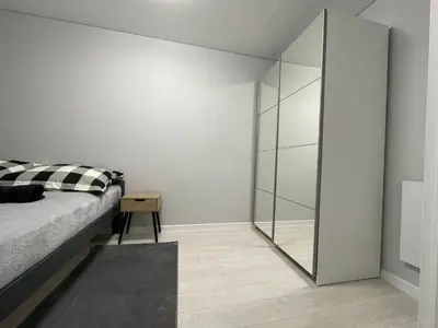 Łóżko lub łóżka w pokoju w obiekcie Apartament Nadbrzezna