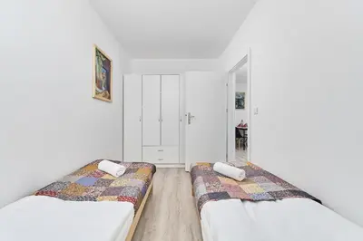 Łóżko lub łóżka w pokoju w obiekcie Drabika Apartment Balcony & Private Parking Wrocław by Noclegi Renters