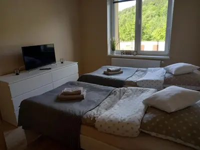 Łóżko lub łóżka w pokoju w obiekcie Apartament Górski
