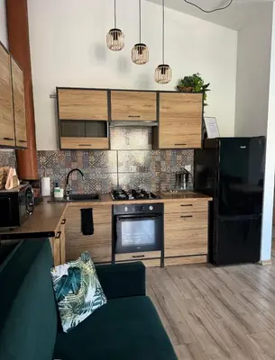 Kuchnia lub aneks kuchenny w obiekcie Dawna Mleczarnia Apartamenty MIODOWY