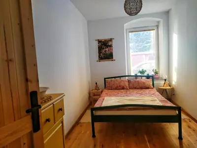 Łóżko lub łóżka w pokoju w obiekcie Apartament Borówka