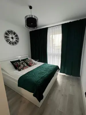 Łóżko lub łóżka w pokoju w obiekcie Apartament Poznańska