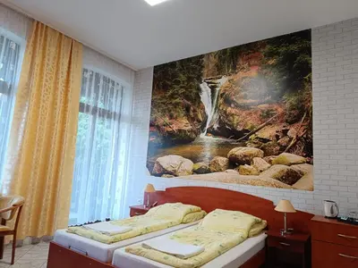 Łóżko lub łóżka w pokoju w obiekcie Dom Wczasowy Magnolia