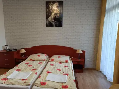 Łóżko lub łóżka w pokoju w obiekcie Dom Wczasowy Magnolia