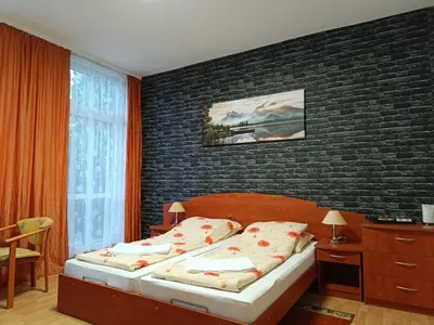 Łóżko lub łóżka w pokoju w obiekcie Dom Wczasowy Magnolia
