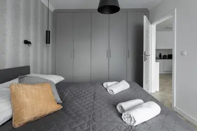 Łóżko lub łóżka w pokoju w obiekcie Apartament z kominkiem