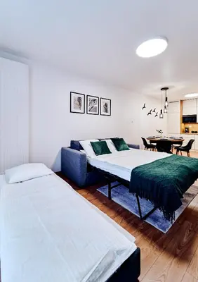 Łóżko lub łóżka w pokoju w obiekcie ApartFonte - Mickiewicza 2A - garaż podziemny