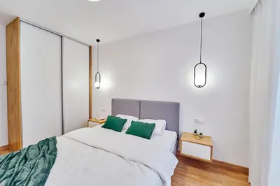 Łóżko lub łóżka w pokoju w obiekcie ApartFonte - Mickiewicza 2A - garaż podziemny