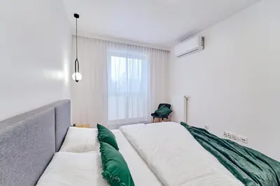 Łóżko lub łóżka w pokoju w obiekcie ApartFonte - Mickiewicza 2A - garaż podziemny