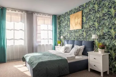 Łóżko lub łóżka w pokoju w obiekcie Staycity Apartments Sukiennice 6