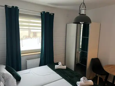 Łóżko lub łóżka w pokoju w obiekcie Apartamenty Slowianka -Studio