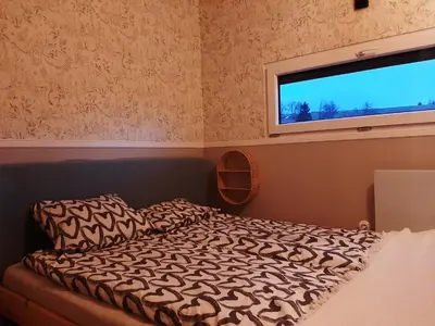 Łóżko lub łóżka w pokoju w obiekcie Antracytowe Domki w Górach Sowich