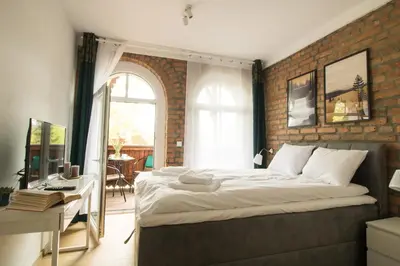 Łóżko lub łóżka w pokoju w obiekcie Apartamenty Dębowa 3