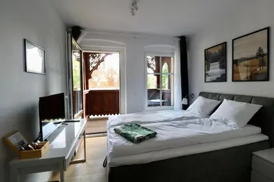 Łóżko lub łóżka w pokoju w obiekcie Apartamenty Dębowa 3