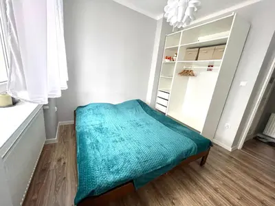 Łóżko lub łóżka w pokoju w obiekcie Apartament Jaskółka