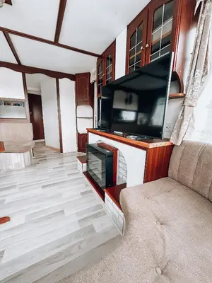 Telewizja i/lub zestaw kina domowego w obiekcie Domki Parkowy