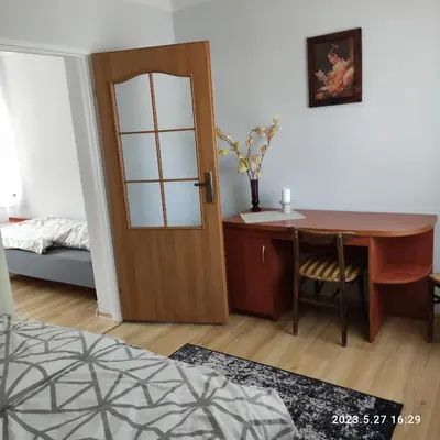 Łóżko lub łóżka w pokoju w obiekcie Apartament Pod Lipą
