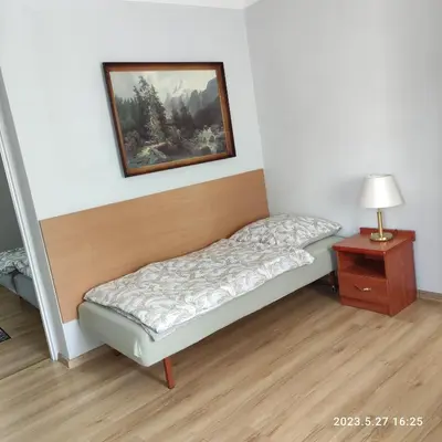 Łóżko lub łóżka w pokoju w obiekcie Apartament Pod Lipą