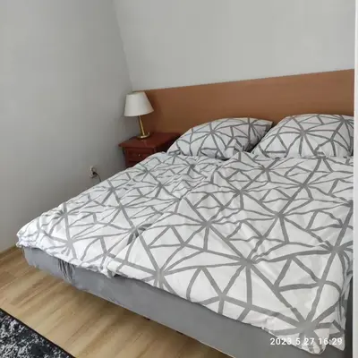 Łóżko lub łóżka w pokoju w obiekcie Apartament Pod Lipą