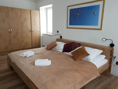Łóżko lub łóżka w pokoju w obiekcie Apartament Zimowiec