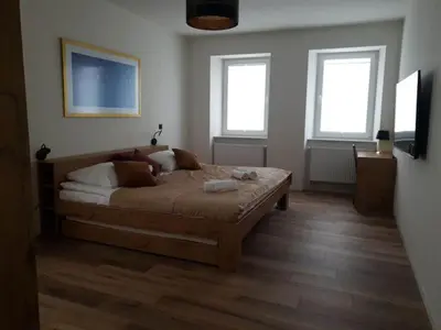 Łóżko lub łóżka w pokoju w obiekcie Apartament Zimowiec