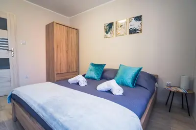 Łóżko lub łóżka w pokoju w obiekcie Apartament w Kamienicy na Kłodzkiej