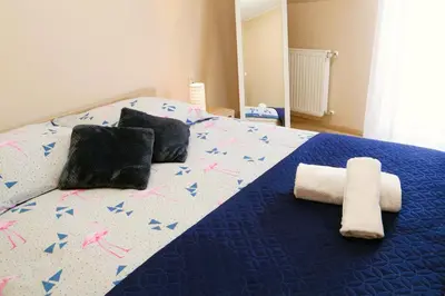Łóżko lub łóżka w pokoju w obiekcie Apartament w Kamienicy na Kłodzkiej