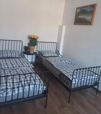 Łóżko lub łóżka w pokoju w obiekcie Apartament Stara Tkalnia
