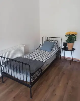 Łóżko lub łóżka w pokoju w obiekcie Apartament Stara Tkalnia