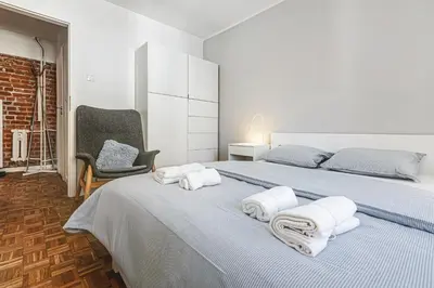 Łóżko lub łóżka w pokoju w obiekcie Muzyczna Oaza Przy Rynku