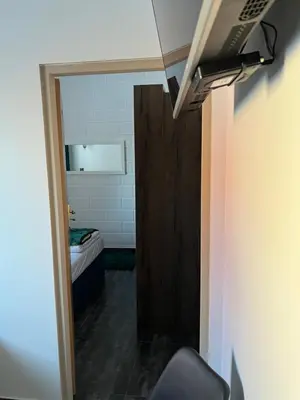 Łóżko lub łóżka w pokoju w obiekcie Apartamenty Słowianka-BUTELKOWY