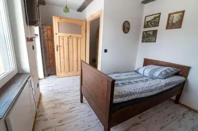Łóżko lub łóżka w pokoju w obiekcie Mieciówka