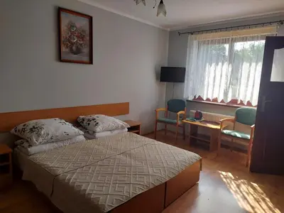 Łóżko lub łóżka w pokoju w obiekcie Agroturystyka Zielony Ogród
