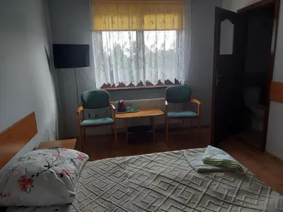Łóżko lub łóżka w pokoju w obiekcie Agroturystyka Zielony Ogród