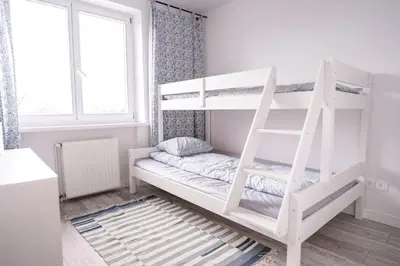 Łóżko lub łóżka w pokoju w obiekcie Z widokiem na Zamek