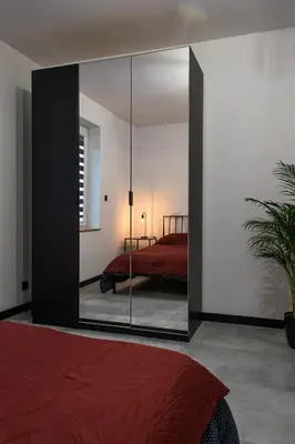 Łóżko lub łóżka w pokoju w obiekcie Apartament Black Loft