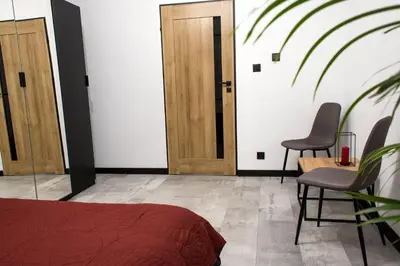 Łóżko lub łóżka w pokoju w obiekcie Apartament Black Loft