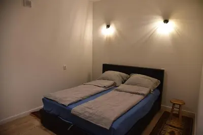 Łóżko lub łóżka w pokoju w obiekcie Apartament Dworcowa