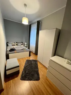 Łóżko lub łóżka w pokoju w obiekcie Apartament pod Góralką