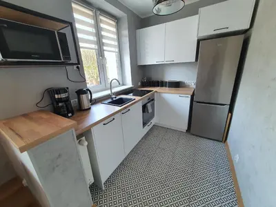 Kuchnia lub aneks kuchenny w obiekcie JDK Apartamenty Legionów 32m2 4-osobowy