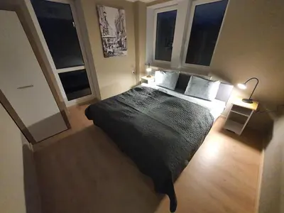 Łóżko lub łóżka w pokoju w obiekcie JDK Apartamenty Legionów 74m2 8-osobowy