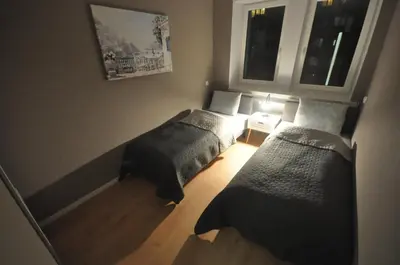 Łóżko lub łóżka w pokoju w obiekcie JDK Apartamenty Legionów 74m2 8-osobowy