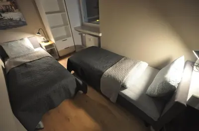 Łóżko lub łóżka w pokoju w obiekcie JDK Apartamenty Legionów 74m2 8-osobowy