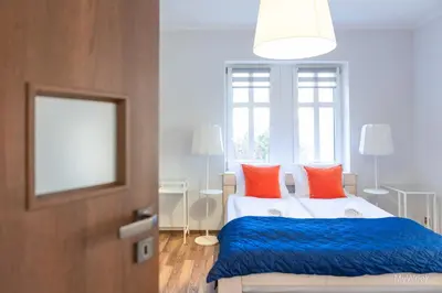 Łóżko lub łóżka w pokoju w obiekcie Apartament na deptaku z klimatyzacją, MyWeek