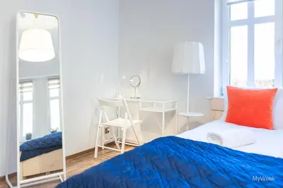 Łóżko lub łóżka w pokoju w obiekcie Apartament na deptaku z klimatyzacją, MyWeek