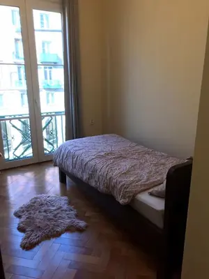 Łóżko lub łóżka w pokoju w obiekcie Stylowy apartament w centrum