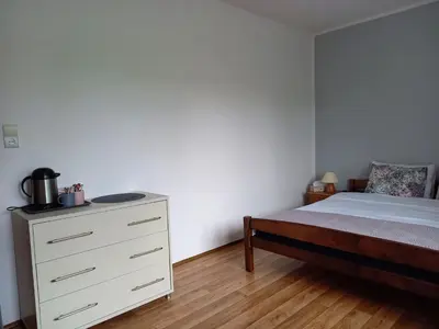 Łóżko lub łóżka w pokoju w obiekcie Apartamenty AGAT