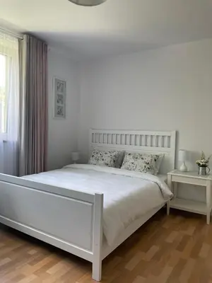 Łóżko lub łóżka w pokoju w obiekcie Apartamenty AGAT