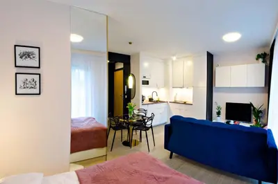 Łóżko lub łóżka w pokoju w obiekcie Cherub Apartment