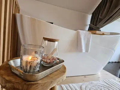 Łóżko lub łóżka w pokoju w obiekcie Domki Pod Lasem - Domek Brzozowy